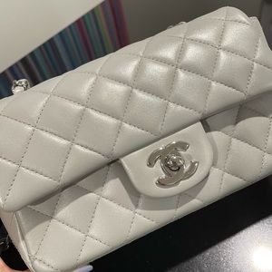 Chanel authentic grey quilted lambskin mini classic flap. Includes dust bag.